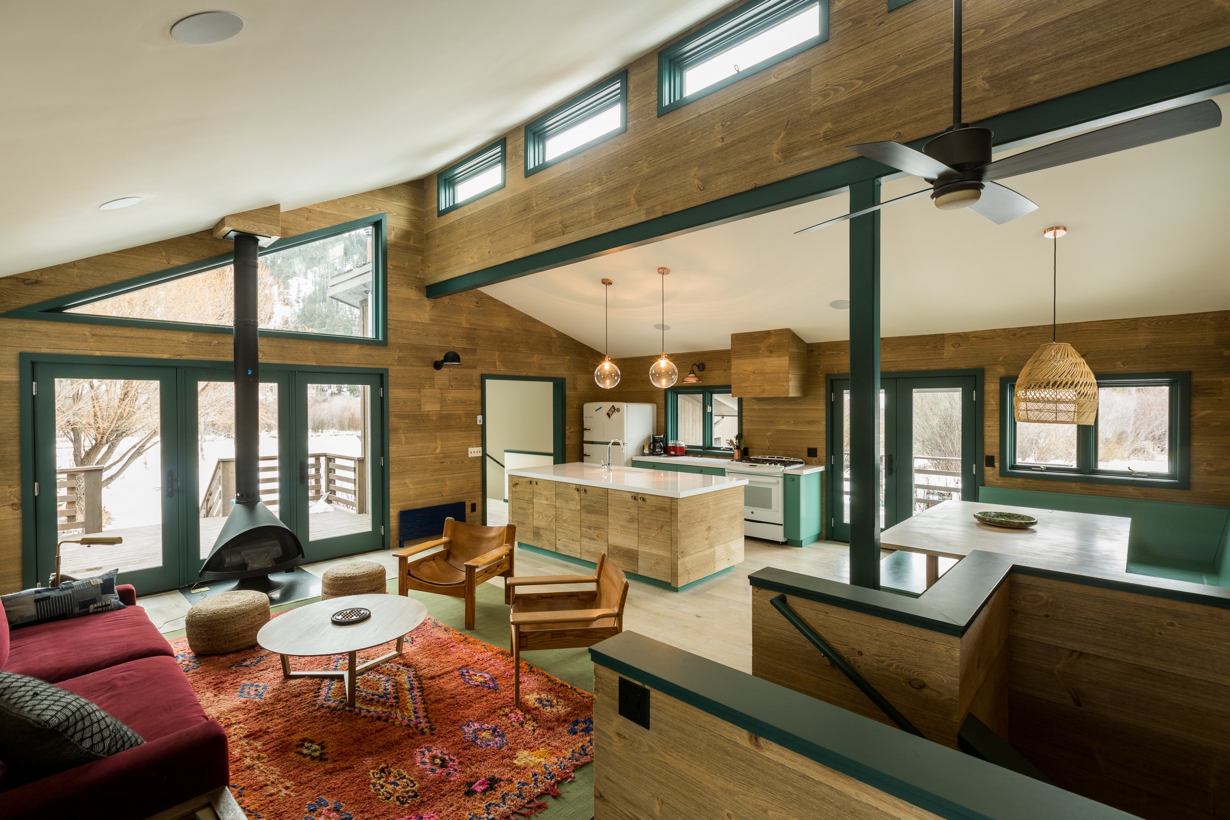 Living room with the kitchen in the background